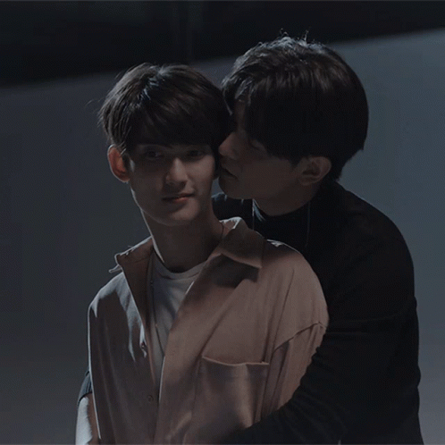 Man Kissing Another Man on Cheek
