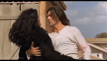 Man Kissing Woman