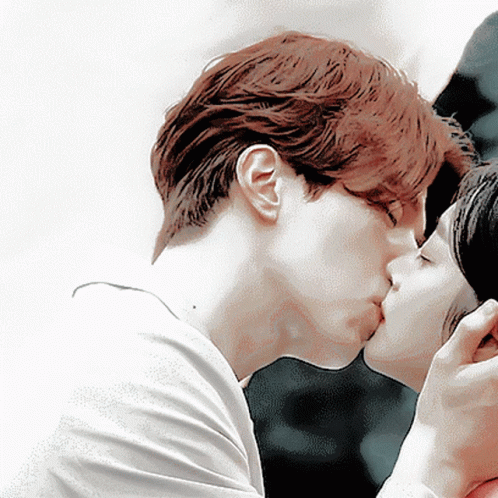 Man Kissing Woman On Cheek GIF