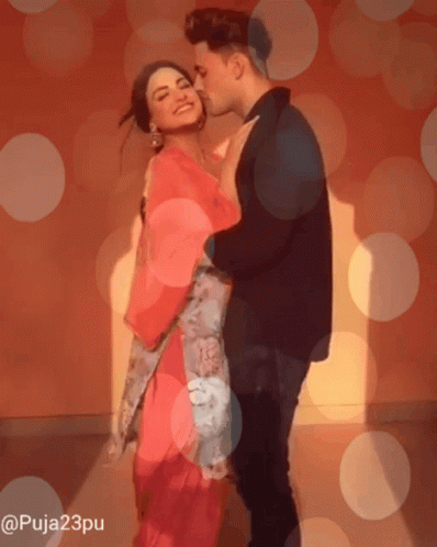 Man Kissing Woman On Cheek GIF