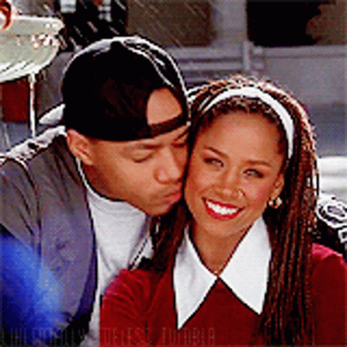 Man Kissing Woman on Cheek