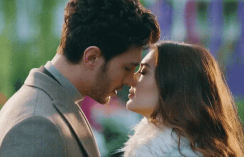 Man Kissing Woman On Forehead GIF