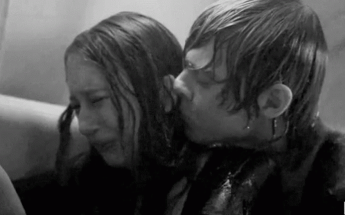 Man Kissing Woman on Forehead Black and White