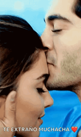 Man Kissing Woman on Forehead