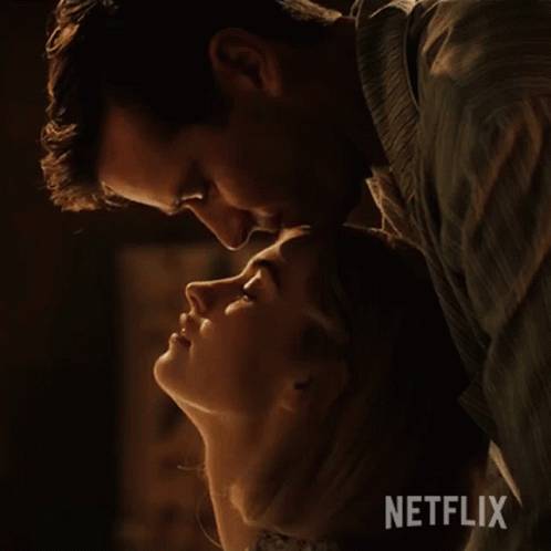 Man Kissing Woman On Forehead With Netflix Logo GIF