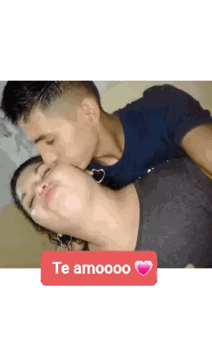 Man Kissing Woman with Te Amooo Sticker