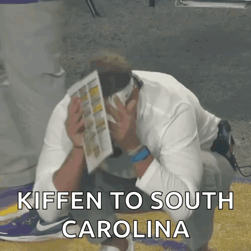 Man Kneeling Head in Hands Kiffen to South Carolina