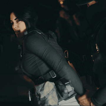 Man Kneeling Holding Gun In Burning Building GIF