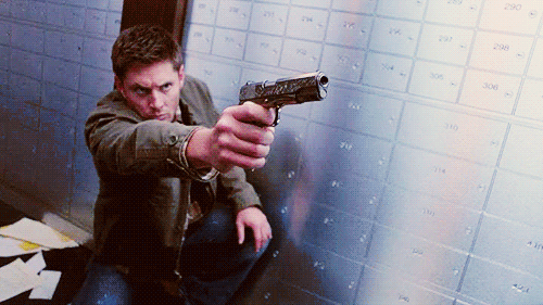 Man Kneeling Holding Gun GIF