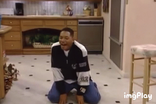 Man Kneeling in Black and White Sweater 32
