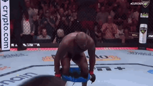 Man Kneeling In Boxing Ring Crypto.com Ad GIF