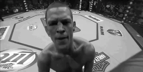 Man Kneeling in Boxing Ring