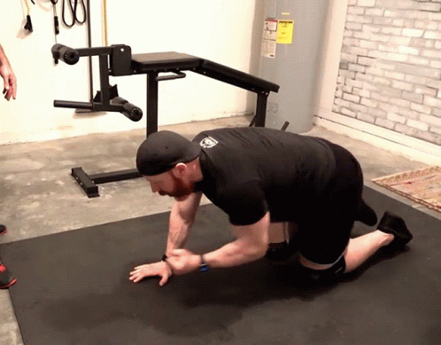 Man Kneeling In Front Of Water Heater GIF