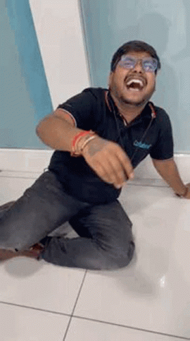Man Kneeling Laughing Making Funny Face