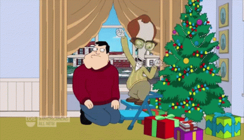 Man Kneeling Next to Christmas Tree Saying American Dad All New