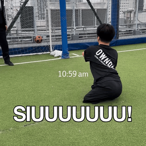 Man Kneeling on Soccer Field 10:59