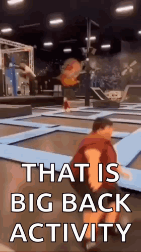 Man Kneeling on Trampoline That Is Big Back Activity