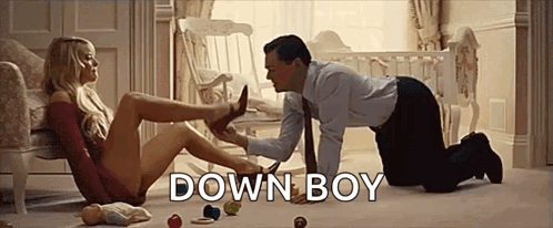 Man Kneeling Putting Womans Shoe On