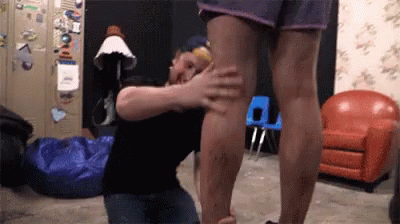 Man Kneeling Touching Woman's Leg GIF