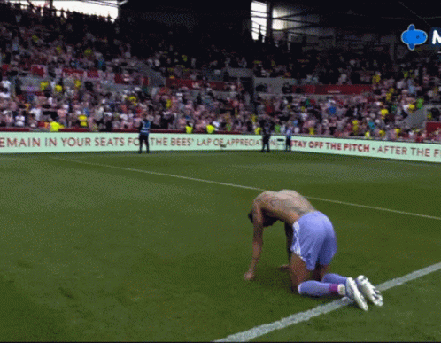 Man Kneeling with Remain in Your Seats Sign