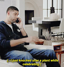 Man Knocking Over Plant While Celebrating
