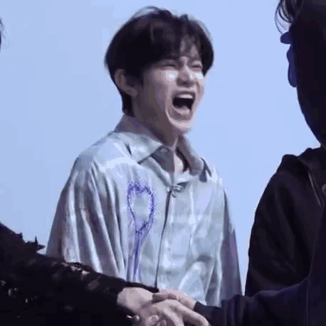 Man Laughing Holding Another's Hand