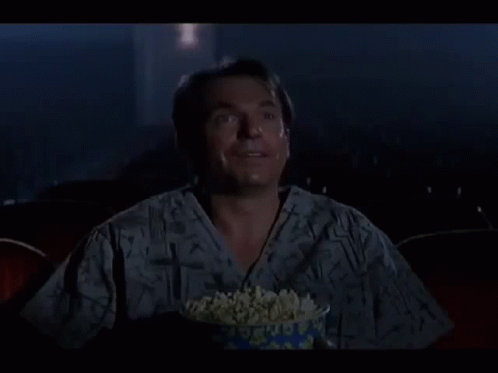 Man Laughing Holding Bowl Of Popcorn GIF