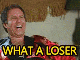 Man Laughing in Chair Saying What a Loser