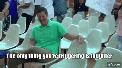 Man Laughing In Row Of Chairs GIF