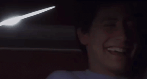 Man Laughing With Light Coming Out of Mouth