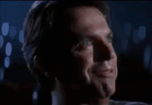 Man Laughing With Mouth Open In Dark GIF