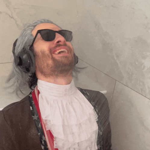 Man Laughing with Sunglasses and Headphones
