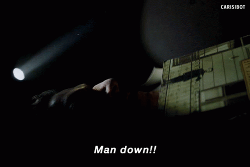 Man Laying Down Hand Pointing Says Man Down