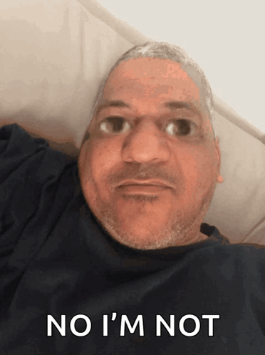 Man Laying in Bed With No I'm Not on Face