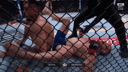 Man Laying in Cage With Brundage