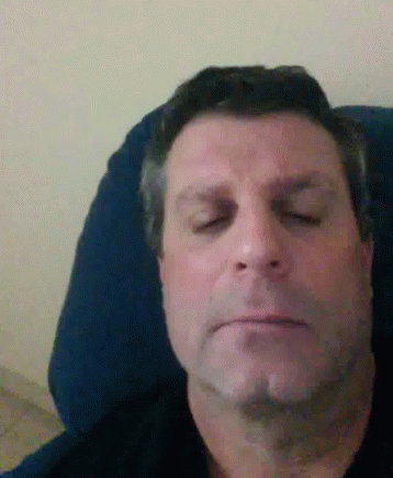 Man Laying in Chair Eyes Closed