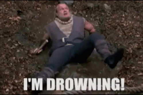 Man Laying in Dirt Saying I'm Drowning