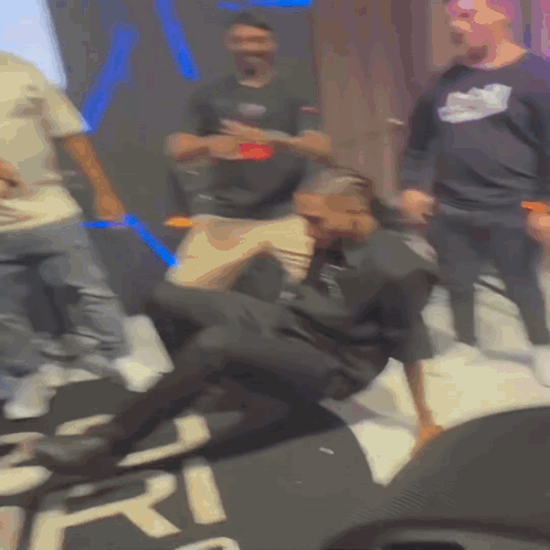 Man Laying In Front Of Sign Saying Ri GIF