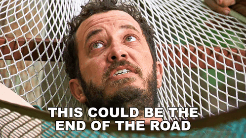 Man Laying in Hammock This Could Be the End of the Road