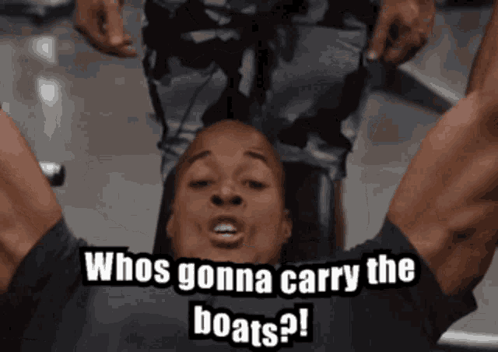 Man Laying on Back Saying Whos Gonna Carry The Boats