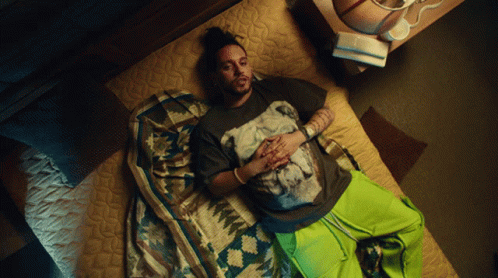 Man Laying On Bed In Horse T-Shirt GIF