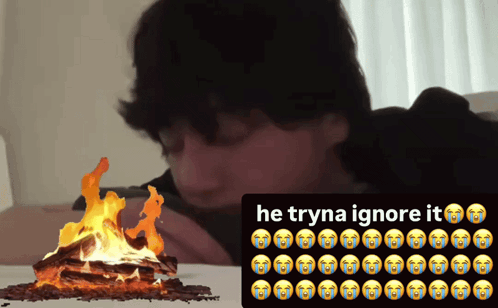 Man Laying on Bed Next to Fire Trying to Ignore It