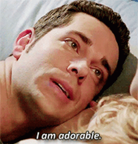 Man Laying on Bed Saying I Am Adorable