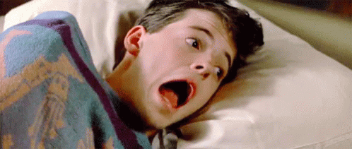Man Laying On Bed With Blanket On Head GIF