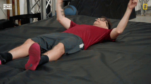 Man Laying On Bed With Breaking Bobby Bones GIF