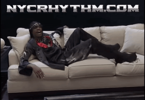 Man Laying on Couch With nycrhythm.com