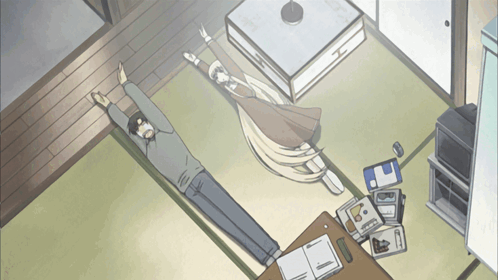 Man Laying On Floor With Outstretched Arms GIF