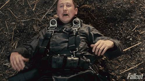 Man Laying on Ground With Fallout