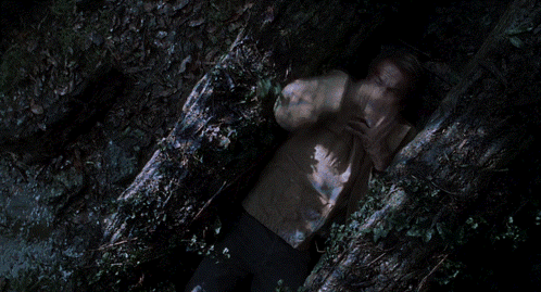 Man Laying On Ground With Hands Over Face GIF