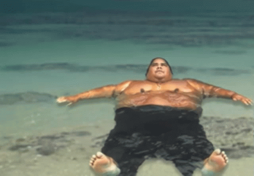 Man Laying On His Back In Water GIF